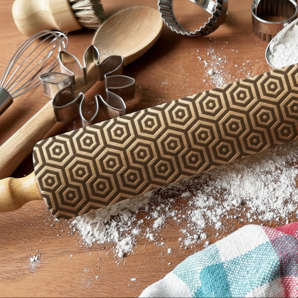 Hexagonal patterned rolling pin on a wooden surface with flour and cookie cutters, featuring 'PicnicandPeachStudio' branding.