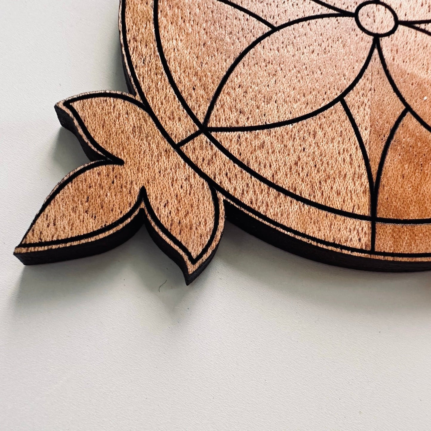 Wooden coaster on a light gray background