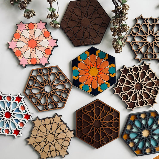 Hexagonal decorative coasters with geometric patterns on a white background