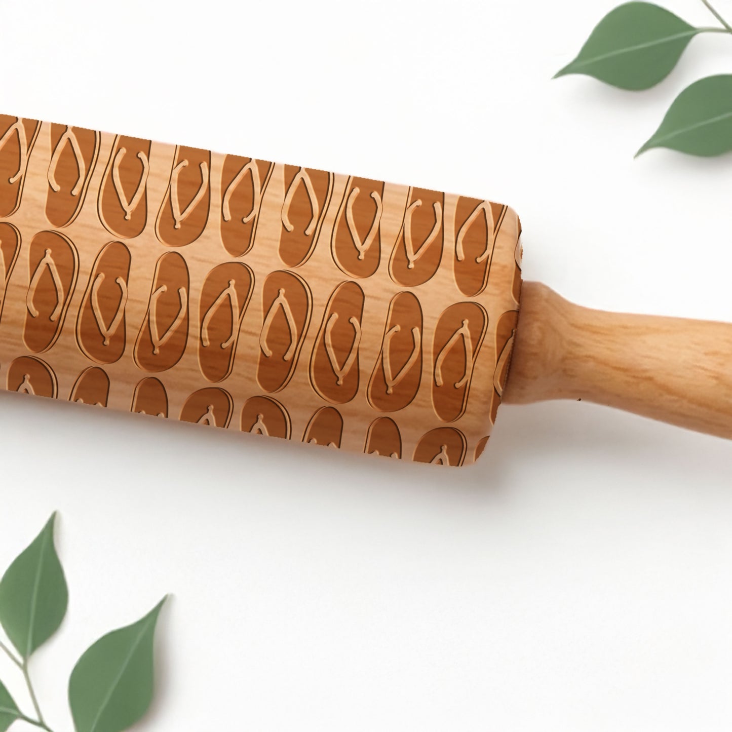 Wooden rolling pin with flip flop pattern on a white background