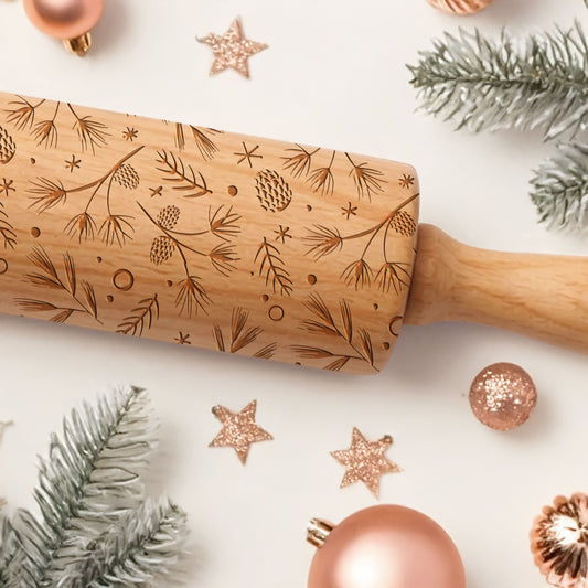 Wooden rolling pin with engraved patterns on a festive background with Christmas decorations.