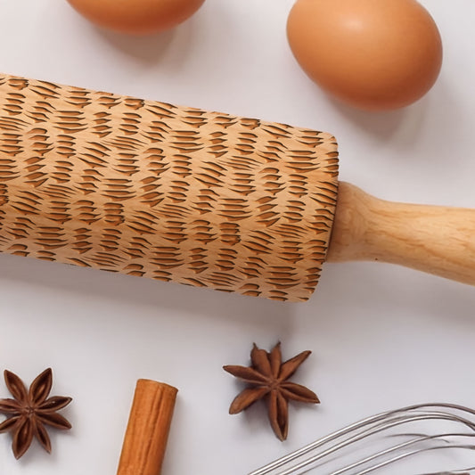 Wooden rolling pin with star anise, cinnamon stick, and eggs on a white background