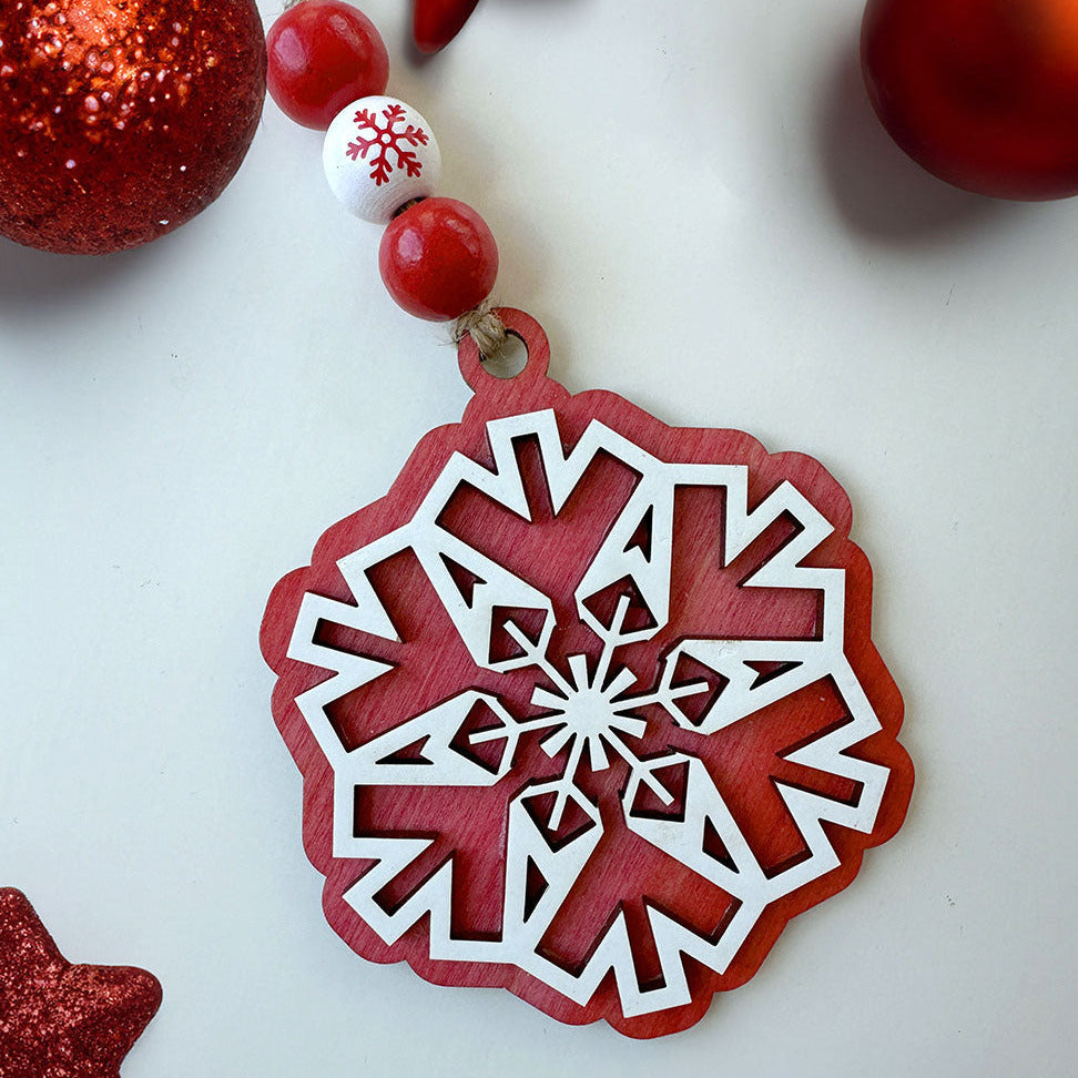Red and white snowflake ornament with Christmas decorations on a light background