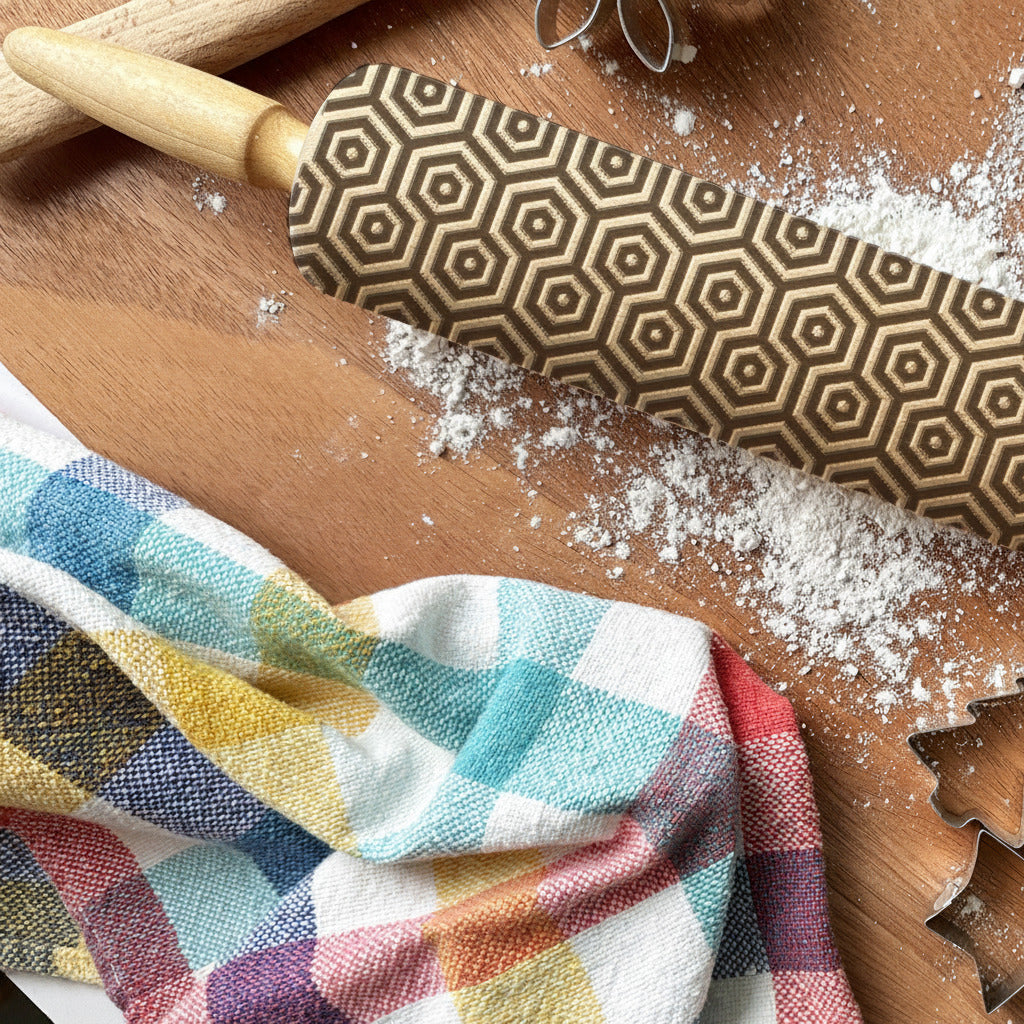Baking tools including a rolling pin, cookie cutters, and a wooden spoon on a wooden surface with flour, branded 'PickleandPeachStudio'.