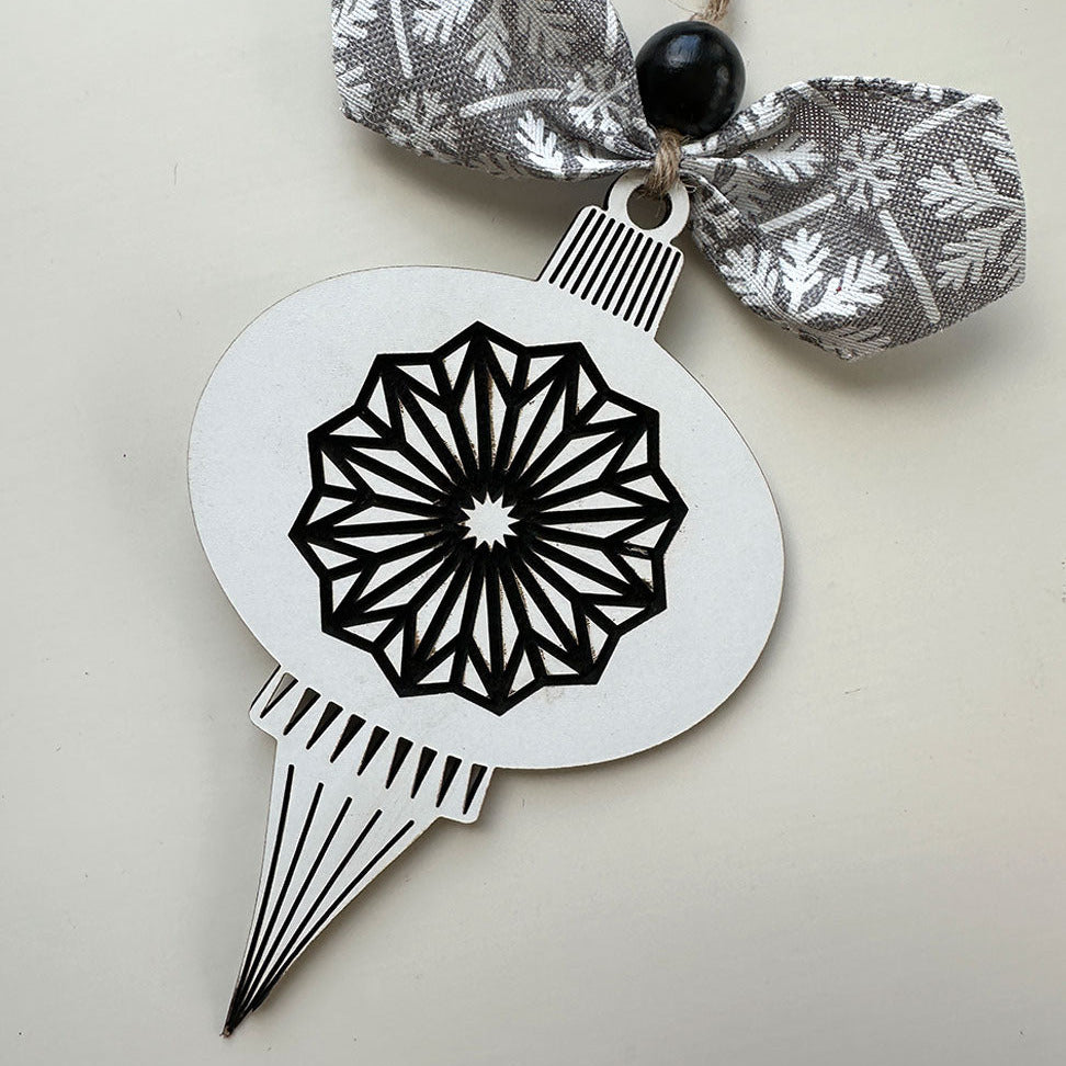 Decorative ornament with geometric design on a plain background